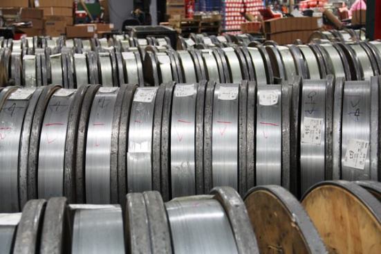 This glued material will be punched into staples or finish nails within a matter of days. If it sits around too long the glue will over-cure and the strands of wire will separate in the machine.