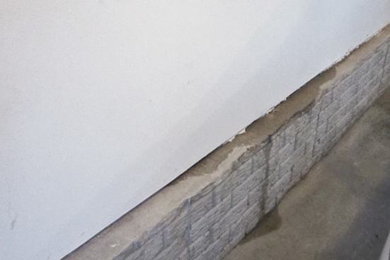 After hosing down the upper wall to confirm the leakage pathway, we tore off the drywall below the window.