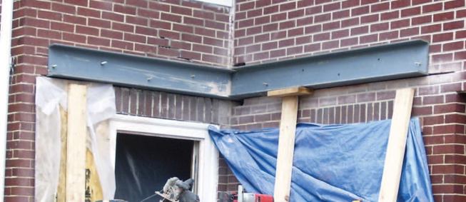 The shorter channel was added. The right-angle joint at the intersection of the steel channels was later welded.