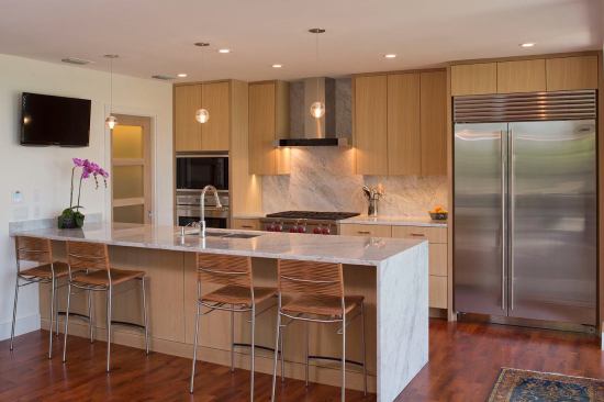 Rift Sawn White Oak cabinets and Carrera Marble counter tops complement the Mesquite floors well!