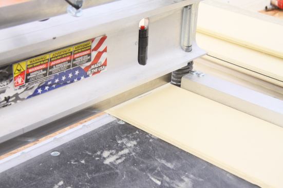 Cut lines are easy to align with the blade, making for accurate cuts. A built-in laser (shown with the red button, though not turned on) is meant to offer additional aide but in bright light and on light colored materials it can be hard to read, rendering it unnecessary.