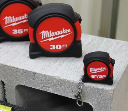 Milwaukee’s original tapes were aimed at specialty contractors; their new line (which came out earlier this year) is aimed at general contractors. The new models have the same proprietary blade coating as the originals and the same 5-point frame but a wider bottom to prevent them from tipping. The cost of the tapes was lowered by printing on only one side of the blade and omitting the finger stop and magnetic end—items I as a carpenter don’t really care about. The 16’ and 25’ models are already out; 30’ and 35’ models will be available in September 2015. A 6’ keychain model will come out in November 2015.
