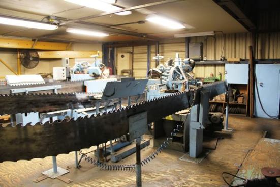 The next step is to sharpen the blade by grinding all edges of the newly installed tips. These are the grinding machines. Blades start out 13 1/2 inches wide and get narrower with each sharpening. By the time Big Creek is done with these blades they’ll be about 9 inches wide. Blades typically last around two years.