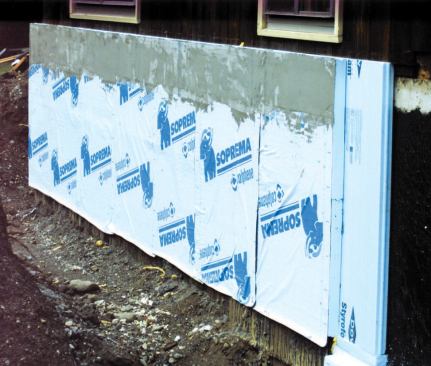 A peel-and-stick ICF waterproofing membrane protects the new foam from moisture below grade, while a stucco coating protects the above-grade portion from UV damage.