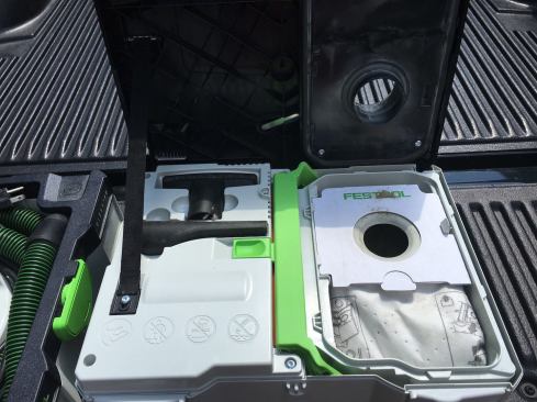 There's onboard storage for two hose attachments (included) beneath the cover.