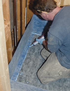 Additional sealant was used to thoroughly cover the joint between the wall membrane and the base.