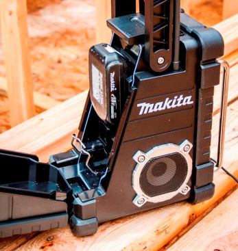 The radio can be powered by an AC adaptor (supplied) that plugs into the front of the unit or by 9.6-volt to 18-volt slide-style batteries that fit into a compartment on back. It does not charge batteries.