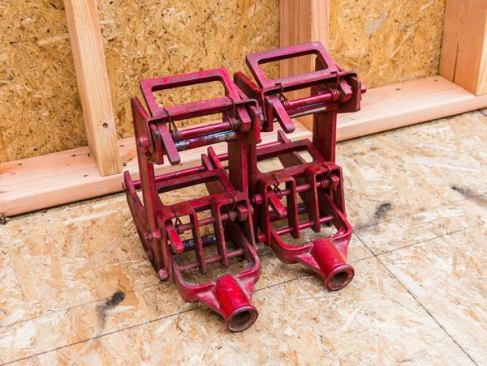 Wall Jacks. Whenever possible we stand walls with the forklift. When that’s not possible (usually because there isn’t access for the machine) we use wall jacks. Ours are from Qualcraft and they’re so easy to use we only lift really small walls by hand because it’s not worth getting hurt to save 5 minutes of setup time. Our local lumberyard stocks them; you can buy them online for about $110.