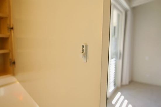 This inexpensive push-to-open touch latch works very well.