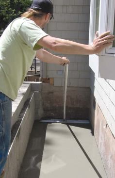 Followed by a poly vapor retarder and a thin slab will help keep the new crawlspace dry.