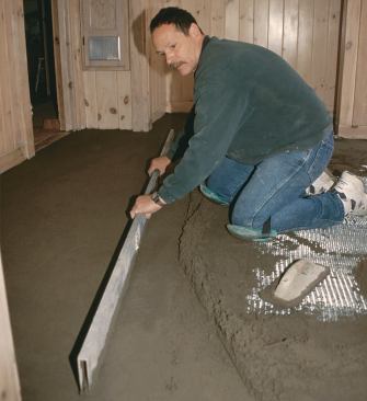 The author floats the floor by adding mix between lines and leveling it with a straightedge.