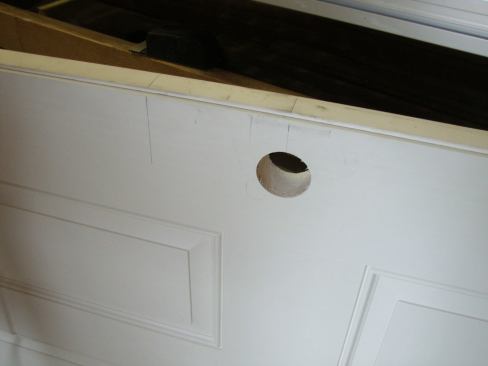 To lay out the position for the jig, Greg first marks the back set for both the lockset and deadbolt. Then he measures from the bottom of the door to the center of the lockset (typically 36 inches) and to the center of the deadbolt (typically 41 inches).