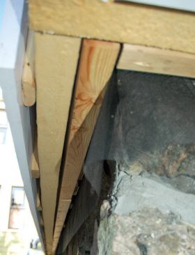 Metal screen (seen hanging) keeps insects out of the drainage space.