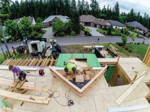 We often install the lap siding—at least inside the gable, where the siding ends must be cut to fit the rake. This is so much easier to do when you aren't on ladders or scaffolding. We have done this with fiber cement, LP SmartSide, and cedar shingle siding.