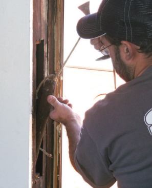 After removing the old units, I take out the weights and pulleys and insulate the cavity.