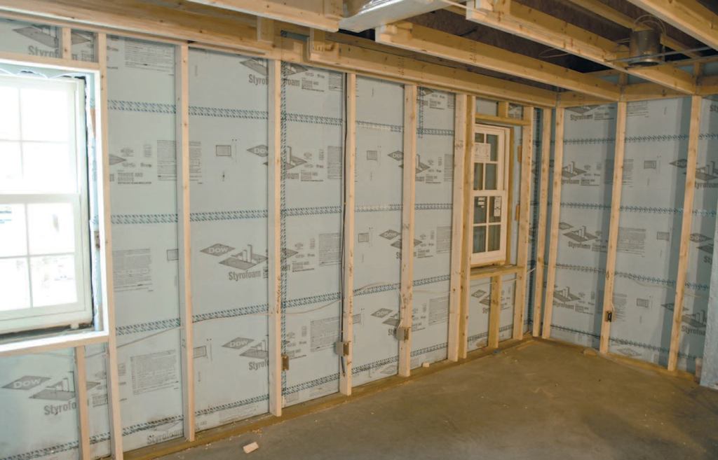 The finished basement walls were insulated to R-25 with a combination of 2-inch XPS foam and R-15 fiberglass batts.