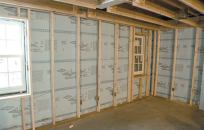 The finished basement walls were insulated to R-25 with a combination of 2-inch XPS foam and R-15 fiberglass batts.