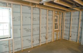 The finished basement walls were insulated to R-25 with a combination of 2-inch XPS foam and R-15 fiberglass batts.