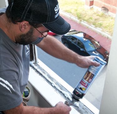 Finally, just before setting the window I spray a bead of foam along the sill.