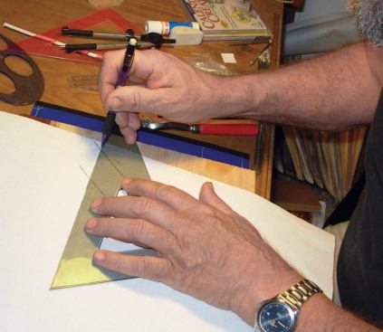 Make a Paper Pattern: I extend the riser line from the original scrap wood pattern to define the outside corner of the tread.