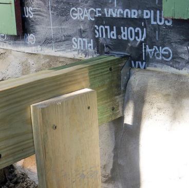 Peel-and-stick membrane protects the hardware and seals the beam pocket.