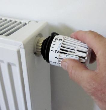 A thermostatic radiator valve provides room-by-room zoning for panel radiators arranged in a home-run layout. A wax-filled sensor in the valve contracts and expands in response to temperature fluctuations in the room, modulating the flow of warm water through the radiator and maintaining the desired room temperature.