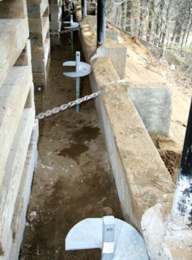 Note the steel chain cast into the original grade beam, which was tied back to the foundation in a failed attempt to stabilize the faulty construction.