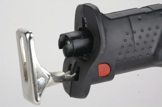 The multiposition shoes of both DeWalt saws and the Makita (shown here) lock in place with a sliding button mechanism. 