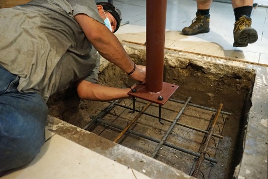 The existing column supports for the basement girder were replaced. Here the footing is being prepped with rebar and anchors.