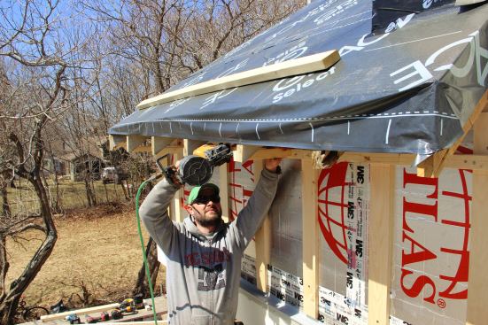 Fenton attaches level soffit nailers to the rafter cheeks.