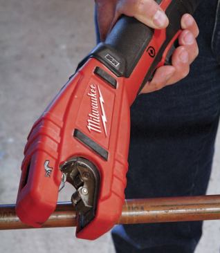 The copper-tubing cutter must be open to grab or release a pipe. To open it you move the control switch in front of the trigger to the far right and then pull the trigger.