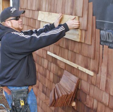 Stacking boards allow the author’s crew to quickly install straight, consistent courses without having to measure every course or snap chalk lines. For 5-inch exposure shingles, the author rips the stacking boards to 4 15/16 inches.