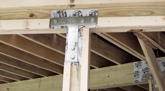In cases where Y-bracing will obstruct views from doors or windows under the deck, the author substitutes rated metal T-straps at column-to-beam connections.