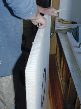 After fine-tuning the fit of the base, I prepared to bond it to the floor.