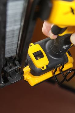 Sliding the switch over reveals a symbol of three nails, indicating bump action mode. This mode works like pneumatic guns: keep the trigger depressed and it will fire every time you bump the tip. The gun also works in sequential mode in this setting.
