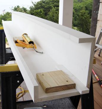 The authors first roughed the scribe cut with a circular saw, then installed blocks to catch the handrail and finished the scribing in place.