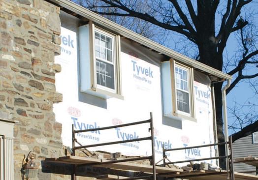 The original windows were reinstalled on plywood extension jambs set into the new frame wall.