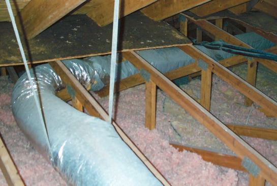 Radiant barrier foil under the rafters stops heat from radiating into the attic, because the foil will not emit heat radiation even when it's hot.