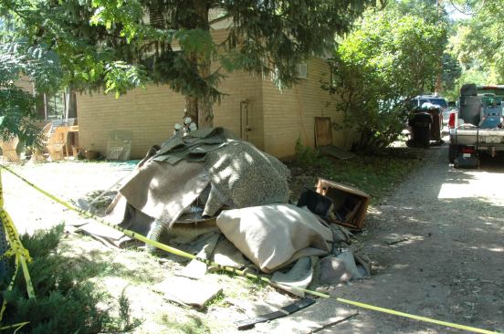 Piles of soaked carpets, furniture, and other belongings were piled in front of houses everywhere.