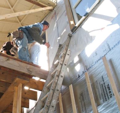 Porch floor joists had to be cut off to allow the insulation board to pass behind.