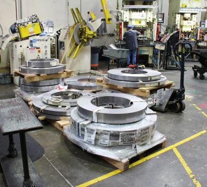 Many of the parts in a Leatherman tool start out as 800-pound coils of steel. This steel was made in Ohio, and will be fed into one of the many punch presses inside the plant. Other parts are laser-cut from flat sheets of steel or forged by outside vendors.