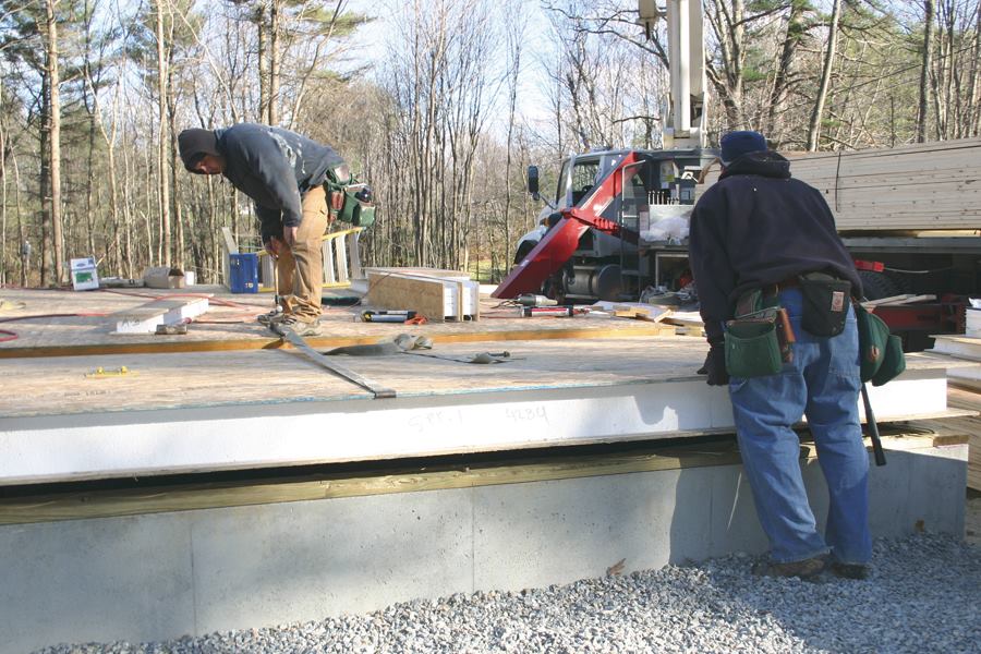 Using floor panels supported by engineered-lumber girders cuts production time on SIP houses.
