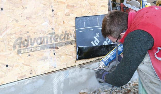 An intentional 3/4-inch gap was left between the insulation-sheathing assembly and the foundation insulation and later filled with spray foam.