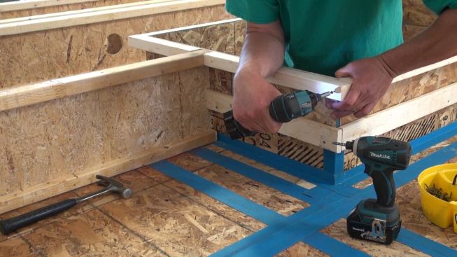 Framing out the outboard edge of the window buck, to bring the opening flush with the outer face of the wood I-joist assembly.
