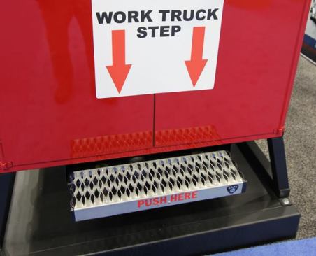 Plenty of companies make steps that fold down or pop out to provide better access to work trucks. This one from Carr works like a touch-latch; push in with your foot and a spring will extend it and again to retract it under the body. The company also offers one with an electric motor controlled by key fob so it extends and retracts with the push of a button. Units are available in multiple sizes, with prices starting at about $300. 
Click here for video.