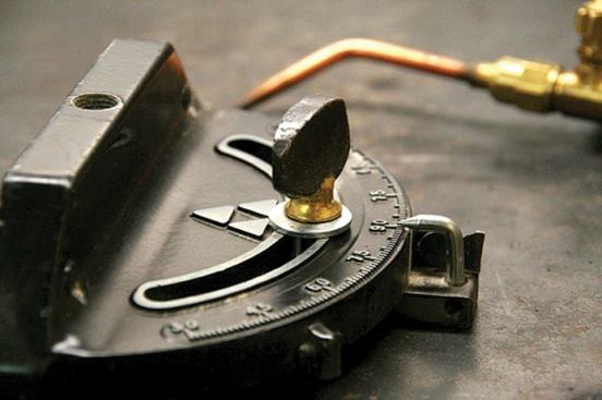 A filler rod supplies the metal that joins the two components together.