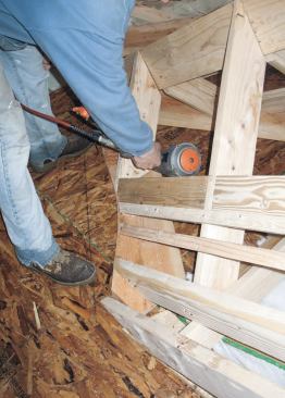 Scribing the Valleys: With the curving valley thus scribed on the 2x12 plates, we pulled them out, cut the curved profile, then reinstalled the plates permanently at the ends of the jack rafters and blocking.
