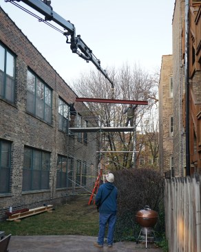 The author’s crew set up scaffolding and craned the replacement beam onto the top lift of scaffolding.