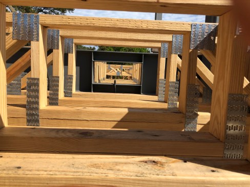 Openings for ductwork were designed into the trusses to align with openings in the steel girders.