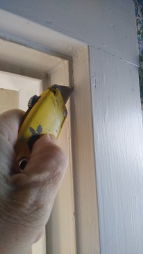 Break the finish bond at seams with a utility knife. This is a good first step with any finished woodwork, but it's a must for heavily painted trim.